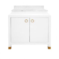 a white cabinet with marble top and two brass handles on the front, against a white background