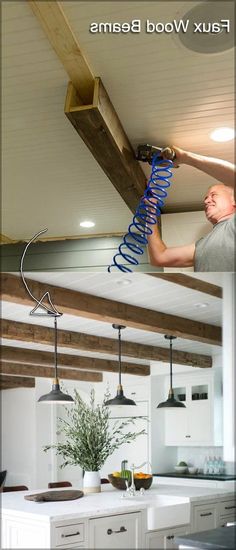 a man is working on the ceiling in his kitchen with blue springs attached to it