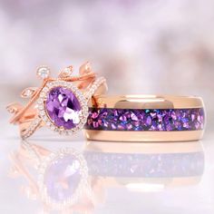 two wedding rings with purple stones and diamonds on the sides, one in yellow gold