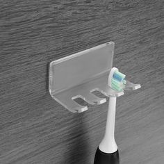 PRICES MAY VARY. Toothbrush holder for bathroom made of acrylic, durable and waterproof. Self adhesive toothbrush hanger suits for smooth surfaces, such as wood, tile, ceramic, metal, plastic. 3 slots toothbrush holder easy to install or remove, no need to nail or drill, without surface damage. The wall mounted toothbrush holder could not only be the toothbrush holder, also a mobilephone holder for charging, razor holder, plug holder, towel, etc. Package Contents: Wall mount toothbrush holder x Electric Toothbrush Holder Ideas, Toothbrush Holder Ideas, Electric Toothbrush Charging Station, Shelf For Electric Toothbrush, Wall Mounted Toothbrush Holder And Soap Dispenser, Toothbrush Organizer, Wall Mounted Toothbrush Holder, Toothbrush Organization, Razor Holder