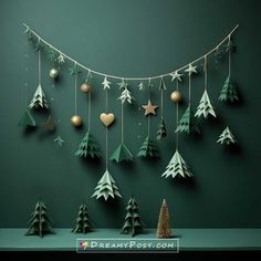 christmas decorations hanging on a green wall with stars and fir trees in the foreground