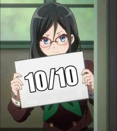 an anime character holding up a sign that says 10 / 10 in front of her face