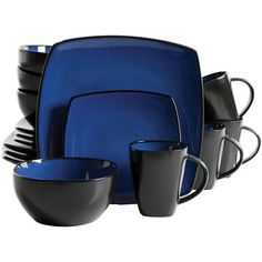 a blue and black dinnerware set with cups