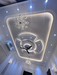 a ceiling with lights and chandelier in a room