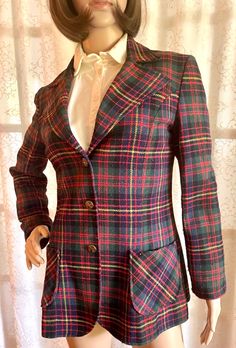 Vintage 1970s Mr B Wool Women's Blazer Jacket, Excellent Condition, Size S This beautiful wool blazer features a wide peak collar with brass buttons and applied pockets. The tag reads "Size 8", but the blazer fits the size "Small" manikin perfectly!  Condition: Excellent, vintage wool blazer is fully-lined and features vivid plaid wool fabric, intact stitching, and original brass buttons. An excellent, vintage piece! Fitted Plaid Wool Sport Coat, Plaid Wool Sport Coat, Winter Fitted Plaid Sport Coat, Winter Plaid Fitted Sport Coat, Plaid Blazer With Buttons For Tailoring, Plaid Blazer With Buttons, Vintage Wool Tweed Jacket For Office, Vintage Outerwear With Welt Pockets For Office, Fitted Plaid Tweed Wool Jacket