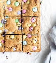 several squares of brownies with easter eggs on them and one square cut in half