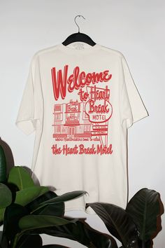 Come and visit Heart Break Motel in this 90's oversized sweatshirt that's perfect for Valentine's Day or even to wear year round! - Features an in-house drawing of Heart Break Motel with "Welcome to Heart Break Motel" above and "where Heart Breakers come to relax" underneath it all in a red ink - Screen print transfer that is heat pressed onto each tshirt - Tshirt is a super soft vintage wash that gets softer after each wash - Oversized fit - Sizing translation: XS/S = L , S/M = XL , L/XL = 2XL Valentines Day Tees, Drawing Of Heart, Svg Tshirt Ideas, One Color Screen Print, Screen Print Tshirt, Valentines Graphic Tee, Boyfriend Tshirt, Quote Tshirt, 90s Tshirt