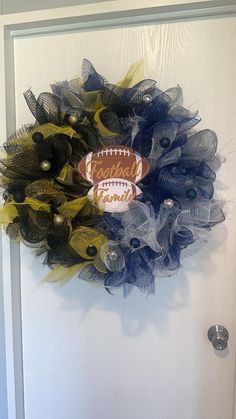 a football wreath hanging on the front door