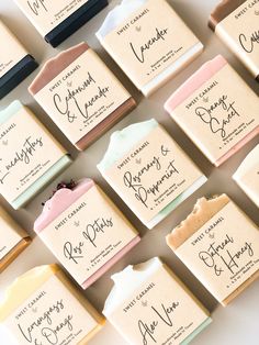 many different types of soaps with labels on them