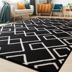 a black and white rug in a living room