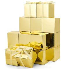 gold gift boxes stacked on top of each other