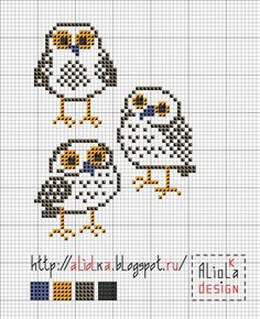 two cross stitch owls sitting on top of each other