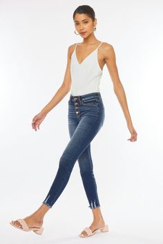 Our Jenny ankle skinny jeans are the perfect skinnies to add to your collection! Features beautiful fading, whiskering, a raw frayed hem with slight distress detail. These jeans also come with an elegant rose gold button fly and a regular 5 pocket design. Regular 5 pockets, Single button front closure, Zip fly 9.5" Rise / 27.5" Inseam (Size 5/26) 74% Cotton, 15% Polyester, 10% Rayon, 1% Spandex Model in size 25 Style # : KC9142D Stretchiness Level >> Stretch Fitted High-rise Distressed Cropped Jeans, Fitted High Rise Distressed Cropped Jeans, Mid-rise Denim Jeggings With Frayed Hem, Mid-rise Medium Wash Jeggings With Frayed Hem, Distressed Mid-rise Fitted Jeggings, Distressed High Rise Jeggings, High Waist Frayed Hem Jeggings For Spring, Trendy High Waist Jeggings With Frayed Hem, Spring High Waist Jeggings With Frayed Hem