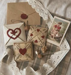 there are many cards on the table with pictures and hearts in them, including one for valentine's day