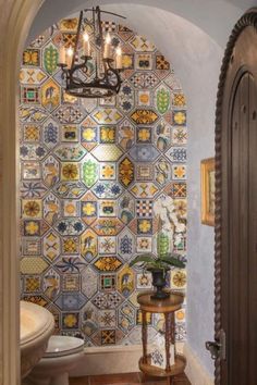 a bathroom with a chandelier hanging from the ceiling