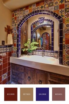 a bathroom with colorful tiles on the wall and sink in front of an arched mirror