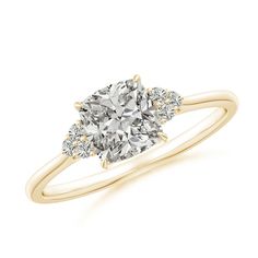 a yellow gold engagement ring with two pear shaped diamonds