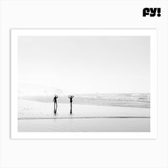 two people are standing in the water at the beach with their umbrellas up and holding hands