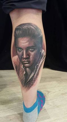 a man's leg with a portrait on it