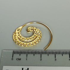 ONE PAIR of open ended sterling silver spiral hoops plated in real gold. Dimensions: 23 x 22 mm These earrings are made of 925 hypoallergenic sterling silver plated in gold. Can be packaged in a gift box. I can include a personal message from you if needed You are welcome to contact me at... bhavnakwintra1956@gmail.com For more beautiful pieces from my shop, please browse 👇 TOE RINGS: https://www.etsy.com/your/shops/TheSilverGame/tools/listings/section:27020628,view:table EAR HOOPS: https://www Unique Gold Cartilage Earrings With Ear Wire, Gold Spiral Brass Hoop Earrings, Spiral Gold Hoop Earrings In Brass, Spiral Brass Hoop Earrings With Ear Wire, Gold Spiral Hoop Earrings, Gold Swirl Earrings For Pierced Ears, Gold Spiral Hoop Earrings Nickel Free, Gold Spiral Hoop Earrings Nickel-free, Gold Spiral Hoop Earrings Gift