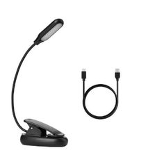 an image of a desk lamp and charger on a white background with clipping for text