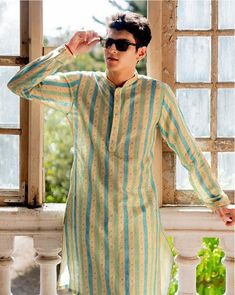 *PRODUCT DETAILS:- This light, Cream stripe print kurta set showcases the beauty of the stripe color green and rama green print style throughout, offering fresh and lively vibes. It features a bandhgala neckline, with simple flat buttons adding a touch of sophistication. The set includes matching payjamas. Style with patterned jutis and a metallic watch. *THREAD TALE:- This Kurta Set has been made by our karigars (craftsmen) with a lot of love and eye for detail. *FEATURES:- Color:  Cream stipe Green Casual Summer Kurta, Casual Green Kurta For Spring, Green Spring Festive Kurta, Green Cotton Kurta For Spring, Traditional Green Kurta For Summer, Festive Green Kurta For Spring, Festive Spring Green Kurta, Pista Green Long Sleeve Kurta For Spring, Casual Yellow Sets For Festive Occasion