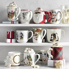 christmas mugs are lined up on the shelves