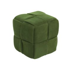 a green cube shaped ottoman sitting on top of a white floor