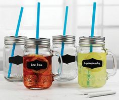 four mason jars with blue and yellow straws in them, one has a black label on the lid