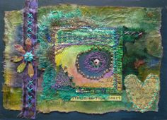 an art journal with mixed media collages and embellishments