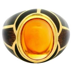 –Stone(s)– (1) Natural Genuine Citrine - Oval Cabochon - Bezel Set - Golden Yellow Color  - 10.16 x 7.96 (approx.) Material: Solid 18k Yellow Gold - Coffee Brown Enamel Weight: 11.04 Grams Ring Size: 6.5 ( fitted on finger, please contact us prior to purchase with sizing inquiries) Ring Width: 15.2mm (0.59") (top of the ring - north to south) - 4.5mm (bottom of the shank) Ring Height: 11.59mm (rise off finger) Condition: Light wear, excellent overall condition. Stock Number: JO-15060333 Gold Mosaic, Sapphire Cocktail Ring, Golden Yellow Color, Vintage Cocktail Ring, 11 59, Citrine Ring, Citrine Stone, 18k Yellow Gold Ring, Modern Ring