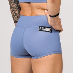 These Butter Soft Booty Shorts are all the rage! Periwinkle blue gym shorts that move with you—not against you. Our classic solid color booty shorts are a must-have for every woman that is serious about her fitness journey. Savage classic booty shorts are custom-made with a perfect blend of Butter Soft nylon and spandex. Our 4-way stretch performance fabrics are soft, comfortable, squat proof, and stay in place so you can achieve full range of motion in and out of the gym. With our light blue sp Fitted Solid Color Squat Proof Shorts, Fitted Squat Proof Shorts, Blue Boxer Briefs With Built-in Shorts For Sports, Blue Sporty Activewear For Cheerleading, Blue Sporty Squat Proof Athletic Shorts, Blue Sporty Squat-proof Athletic Shorts, Blue Squat Proof Sporty Athletic Shorts, Cheerleading Athleisure Shorts, Squat Proof Solid Athletic Shorts