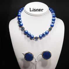 *Description: This is a great Moonglow set by Lisner from the 1950s. The medium blue moonglow Lucite beads also have Lucite clear blue faceted beads with filigree bead caps as in three sections. There are twenty-two Lucite Moonglow beads and three inches of extension chain. The Lisner tag is on one end with the hook clasp with the name Lisner on the back at the other end. The matching blue Moonglow clip on earrings are a little over an inch with the Moonglow cabochon framed in a gold tone frame. Retro Beaded Evening Jewelry, Retro Beaded Jewelry For Evening, Blue Beaded Evening Jewelry, Blue Beaded Jewelry For Evening, Blue Beaded Retro Jewelry, Retro Blue Jewelry For Party, Retro Blue Beaded Jewelry, Vintage Blue Jewelry For Evening, Blue Adjustable Jewelry For Evening