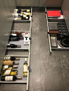 several bottles of wine are sitting on the counter