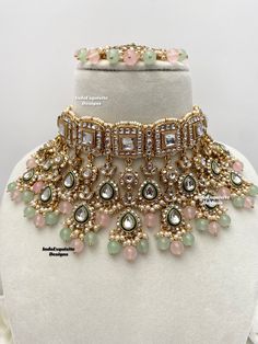 Premium quality elegant Kundan choker comes with Jhumki Earrings and Tikka/ Indian Jewelry/Premium Quality Polki and Kundan Jewelry/pink mint/pink sage green/pink pista    All items are shipped from Brampton, Ontario, Canada. If you need your item by a certain day, please reach out to us for express delivery option before placing the order so that we can update the shipping for you. Standard shipping/delivery timeline Below are the delivery timeline estimates. We dispatch all orders by the next Luxury Hand Set Choker For Diwali, Luxury Hand Set Traditional Choker, Luxury Kundan Necklace With Pallu For Eid, Green And Pink Jewellery Set, Luxury Pink Kundan Bridal Necklace, Luxury Pink Kundan Necklace With Meenakari, Luxury Pink Kundan Necklace For Festive Occasions, Luxury Pink Kundan Necklace For Wedding, Luxury Pink Kundan Necklaces