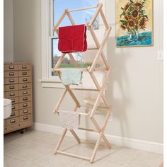 a clothes rack in the corner of a room