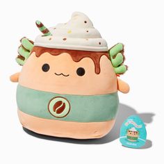 a small stuffed toy with an ice cream cone on it's head and eyes