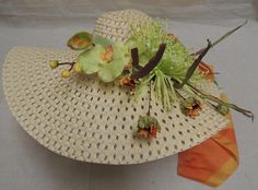 "Floppy Hat With Flowing hat band and Flowers / hippy / boho. This hat is adorned with a vintage scarf of orange yellow and green. It has light green Orchids and a large light green Dahlia, nestled by tiny orange flowers and spike like leaves of green and brown. Dimensions are approx. 22\" across and head size is approx. 7 1/2\". A great hat for that fresh new outfit." Vintage Brown Sun Hat For Festivals, Green Bohemian Hat Bands For Summer, Bohemian Green Hat Bands For Summer, Bohemian Green Summer Hat Bands, Multicolor Bohemian Sun Hat For Kentucky Derby, Bohemian Adjustable Sun Hat For Garden Party, Bohemian Green Hat Band For Country Events, Bohemian Green Hat Bands For Country Events, Green Vintage Adjustable Sun Hat