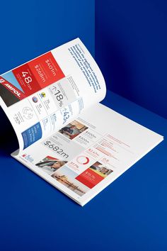 a roll of brochure sitting on top of a blue surface