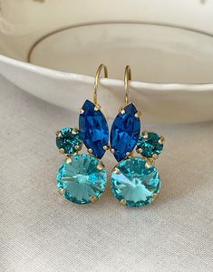 "Gorgeous pair of earrings featuring high quality crystals in shades of blue. 1 1/2\" long x 5/8\" wide. Gold plated settings. Thanks for stopping by!" Blue Bridal Jewelry, Crystal Cluster Earrings, Blue Blossom, Swarovski Crystal Drop Earrings, Something Blue Bridal, Fancy Jewelry Necklace, Bridal Earrings Drop, Blue Bridal, Flower Leaf