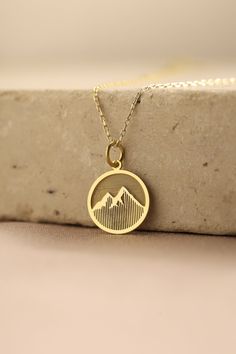 Gold Mountain Pendant - Mountain Gold Necklace ● Material of pendant: Solid Gold 14k ( REAL GOLD ) ● Metal Stamp: 14k ( REAL GOLD ) ● The pendant is available in 5 sizes: - 12,7 mm / 0.5 inches (Diameter) - 14,0 mm / 0,55 inches ( Diameter ) In the photos - 15,3 mm / 0.6 inches ( Diameter ) - 16,5 mm / 0,65 inches ( Diameter ) - 19,1 mm / 0,75 inches ( Diameter ) ( In the photos the size is 14mm / 0.55 inches Diameter ) ( Jump Ring inner diameter: 4 mm ) ● Material of chain: Solid gold 14k ( REA 14k Gold Round Pendant Necklace Gift, Recycled Gold Pendant Charm Necklace For Gift, 14k Gold Pendant Charm Necklace For Anniversary, Gold Necklace Made Of Recycled Gold For Gift, Gold Necklace Of Recycled Gold As A Gift, Gold Recycled Gold Jewelry For Gift, Gold Necklace Of Recycled Gold For A Gift, Yellow Gold Pendant Charm Necklace For Anniversary Gift, Custom Tarnish Resistant Pendant Necklace As Gift