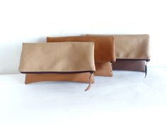 Colorblock vegan leather clutch purse - best quality vegan/faux leather clutch in chocolate brown and sandy beige. Colorblock zippered fold over clutch. *Exterior - Top - high quality medium thick vegan/faux leather in sandy beige color. - Bottom - high quality medium thick vegan/faux leather in chocolate brown . *interior - Fully lined with 100% natural cotton in sandy beige and white polka dot print * Closes with dark brown plastic zipper. Approx. measurments (unfolded): Width -11.5 inch. Heig Versatile Brown Rectangular Clutch, Thick Vegan, Fold Over Clutch, Brown Clutch, Custom Strap, Leather Clutch Purse, Foldover Clutch, Zippered Clutch, Honey Brown