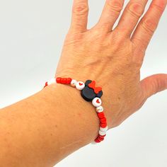 This stretchy, beaded Minnie or Mickey Mouse bracelet is excellent for layering. Hand crafted by the Sharing Sunshine team, this 7.5" glass bead jewelry should fit snug to the wrist. Size, sayings, bead colors, bead layout, etc. are fully customizable. Perfect for someone heading to Orlando soon or to show your love to a huge Disney fan. White Beaded Novelty Stretch Bracelet, White Novelty Beaded Stretch Bracelet, Flexible Beaded Stretch Bracelet Gift, Adjustable Themed Bracelets With Letter Beads, Casual Adjustable Stretch Bracelet With Heart Beads, Adjustable White Themed Stretch Bracelet, Themed Beaded Bracelets With Round Beads As Gift, Adjustable Themed Stretch Bracelet As Gift, White Themed Beaded Bracelet