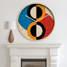 a clock on the wall above a fireplace