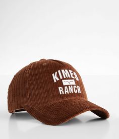 a brown hat with the words kimes ranch printed on it, sitting in front of a white background