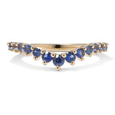 a yellow gold ring with blue sapphire stones