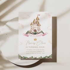 a white plate with a castle on it next to a card that says princess charlotte is turning four