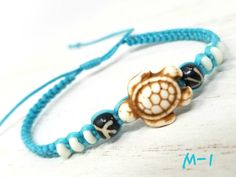 "Handmade Turtle Bracelet perfect for any occasion, the perfect gift, satisfaction guaranteed. Materials: Turquoise Turtle Bead, Black Durable Cord and White Beads. Handmade Turtle Bracelet with Blue Cord, Blue Turtle Beads, Silver Tone Starfish and Clear Beads. Handmade Blue Macrame Bracelet perfect for any occasion, the perfect gift, satisfaction guaranteed. Fast Shipping! Visit my Etsy Shop to see more Handmade Starfish and Turtle Jewelry! https://www.etsy.com/shop/TheArtisansHall At Artisans Handmade Adjustable Turtle Bracelet, Hawaii Room, Turtle Anklet, Shark Jewelry, Hawaiian Bracelets, Blue Macrame, Sea Turtle Bracelet, Blue Turtle, Hemp Bracelet