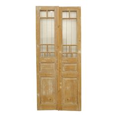 an old wooden double door with glass panels