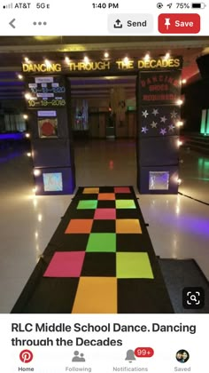 the dance floor is decorated with bright colors and black, yellow, pink, green, orange, and purple squares